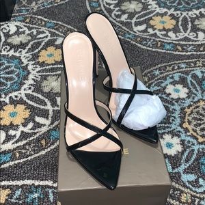 Black patent vegan leather mule.